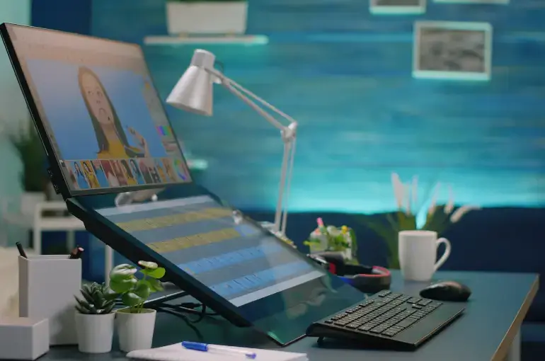 WordPress development agency UI UX design workspace with laptop showing modern responsive web design mockups